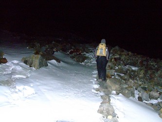 Trekking in the dark before morning